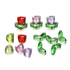 Macro detail of acrylic tulip flower and leaf beads for DIY necklace jewelry making