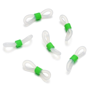 Close-up of translucent white silicone loops with green metal spring adjusters for eyewear