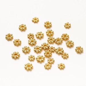 Dettaglio di distanziatori a fiocco di neve placcati oro 6mm per gioielli fai da te