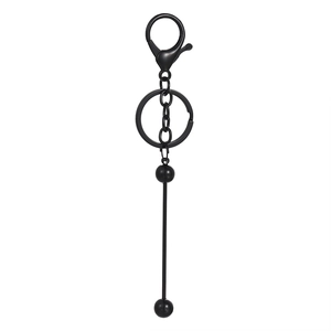 Detailed view of a matte black metal keychain with lobster clasp and bead pendant bar