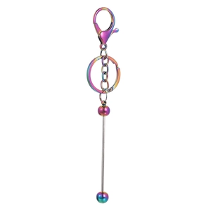 Macro view of gradient rainbow metal keychain with lobster clasp and beaded bar detail
