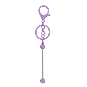Detail of purple matte lobster clasp and metal rod pendant for DIY beaded keychain