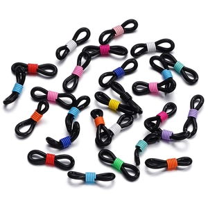 Macro shot of colorful 8-shaped silicone eyeglass chain connectors with adjustable spring