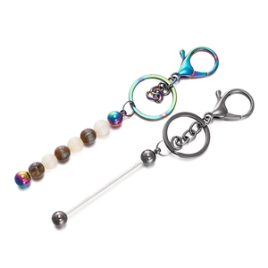 Detail view of colorful gradient metal beads and resin charms on DIY keychain hangers