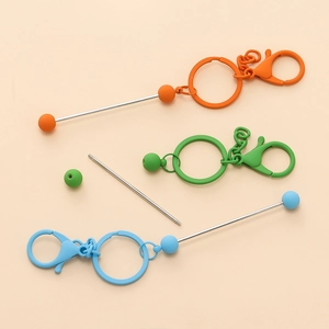 Detail view of colorful DIY beaded keychains with screw-thread rod and lobster clasps