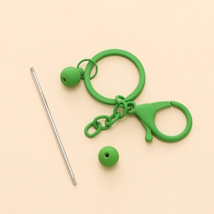 Detail view of bright green DIY beaded keychain kit with round ring and lobster clasp