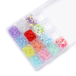 Detail of 4mm colorful peanut beads in a 24-grid storage box for DIY jewelry