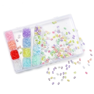Detail of 4mm colorful peanut acrylic beads in a transparent multi-compartment storage box
