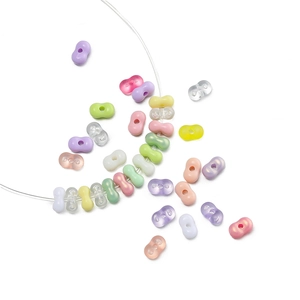 Macro view of 4mm macaron peanut-shaped acrylic beads for DIY jewelry making and crafts