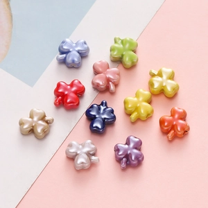 Macro shot of colorful clover flower beads with a pearlescent finish for DIY jewelry crafts