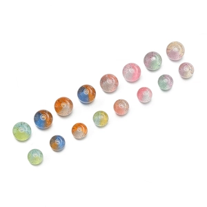 Macro shot of 10mm glitter resin beads with dual-color gradient for DIY jewelry making