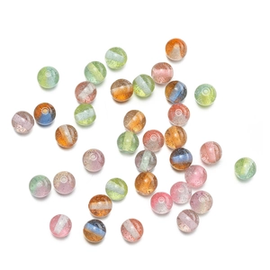 Macro detail of 10mm glitter resin beads with white stripes for DIY jewelry making