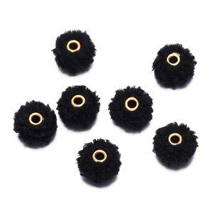 Detail of seven 18mm black teddy velvet beads with golden metal eyelets for DIY crafts
