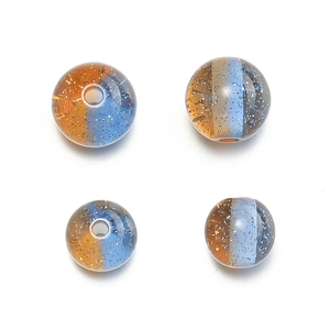 Close-up of 10mm dual-tone resin beads with amber and blue glitter for DIY jewelry making