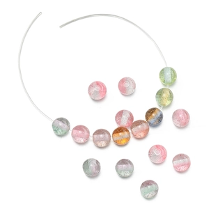 Macro shot of 10mm glitter resin beads with dual-tone bands for DIY jewelry making