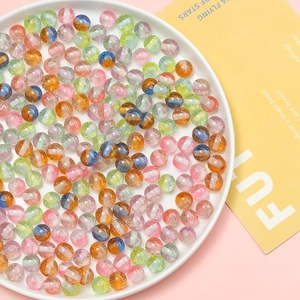 Macro shot of 10mm resin glitter beads with colorful stripes for DIY jewelry making