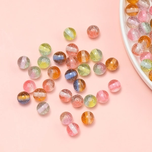 Macro detail of 10mm resin glitter beads with colorful stripes for DIY jewelry making
