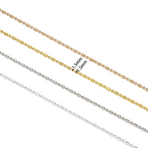 Detailed view of 1.5mm bamboo-style bead chains in gold, silver, and rose gold finish