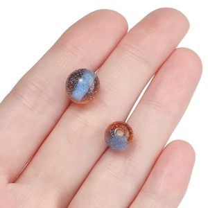 Detailed view of 10mm dual-tone glitter resin beads for DIY jewelry making
