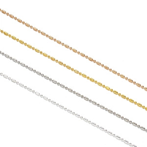 Detailed macro view of 1.5mm bead and cylinder link chains in four metallic colors
