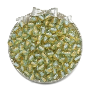 Macro shot of 10mm blue and yellow striped glitter resin beads for DIY jewelry making