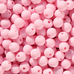 Makroaufnahme matter rosa Acryl-Rundperlen mit geradem Loch für DIY-Schmuckherstellung