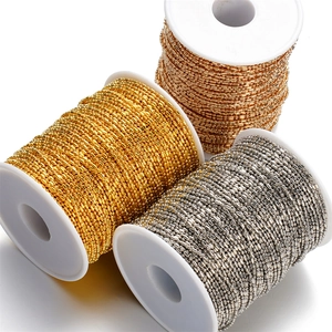 Detailed view of 1.5mm metal bead chains in gold, rose gold and silver on reels