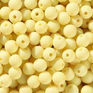 Makroaufnahme von 6/8mm matten gelben Acrylperlen mit vertikalen Löchern für DIY-Bastelarbeiten