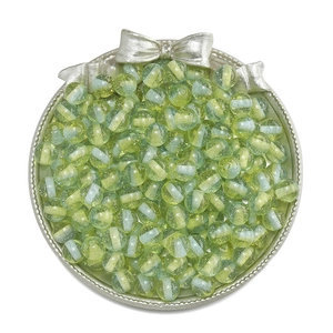 Macro shot of 10mm glittery resin beads in blue and green stripes for DIY jewelry making