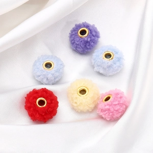 Close-up of 18mm colorful teddy fleece beads with large gold metal inner core for DIY crafts