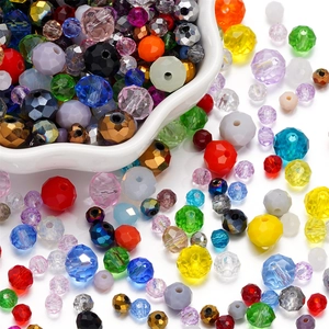 Macro shot of colorful faceted crystal glass beads in a white bowl for DIY jewelry