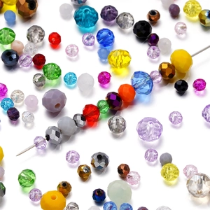 Macro shot of 4-8mm faceted colorful crystal beads on a metal needle for DIY jewelry