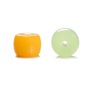 Detail of round orange and green glass cylinder beads with smooth polished finish for DIY