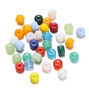 Macro view of multi-colored cylindrical spacer beads with large holes for DIY jewelry