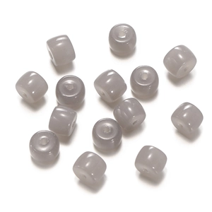 Close-up of pigeon gray glass cylinder beads for DIY jewelry with vertical drill holes