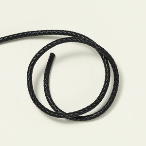Detailed macro view of 3mm black braided genuine leather cord for DIY jewelry