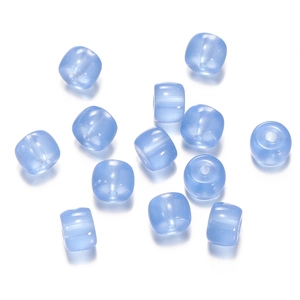 Macro view of translucent light blue cylinder glass beads for DIY jewelry making