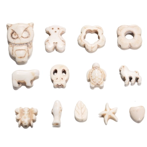 Assorted white synthetic stone beads in animal and flower shapes for DIY jewelry making