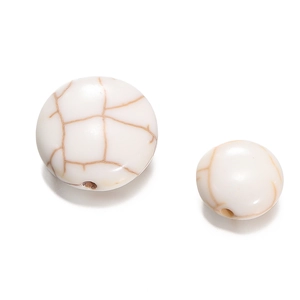Macro detail of white turquoise flat round beads with natural brown marble texture for DIY