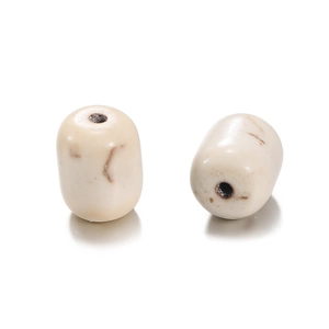 Close-up of two off-white barrel beads with brown veins for DIY jewelry making