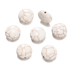 Close-up of white turquoise flat round beads with brown veins for DIY jewelry making