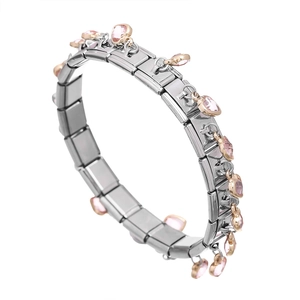 Detail of Italian modular bracelet with pink heart charms and stainless steel links