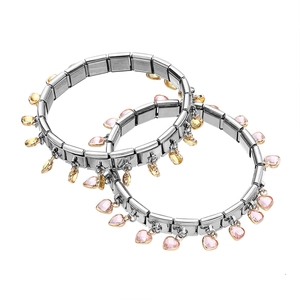 Detailed view of Italian charm bracelet links with pink and amber crystal heart charms