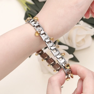 Polished modular stainless steel bracelet with yellow heart-shaped zircon charms