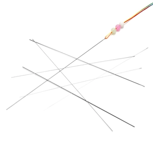 Close-up of thin stainless steel beading needles threading colorful beads for DIY jewelry