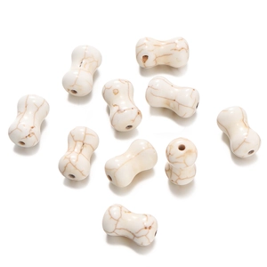 Macro detail of bone-shaped white turquoise beads for DIY jewelry making