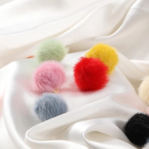 Macro shot of 17mm colorful faux mink fur balls with metal rings for DIY jewelry making
