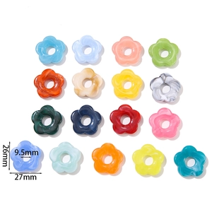 Close-up of 26mm acrylic flower beads showing various colors and precise dimensions