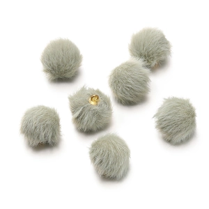 Macro detail of 17mm light grey-green faux mink fur pom-pom beads with gold metal loops