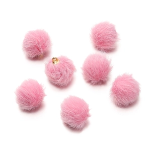 Detail of seven pink faux mink fur pendants with gold metal rings for DIY jewelry craft